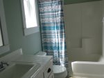 Full size tub and shower combo in guest bedroom 